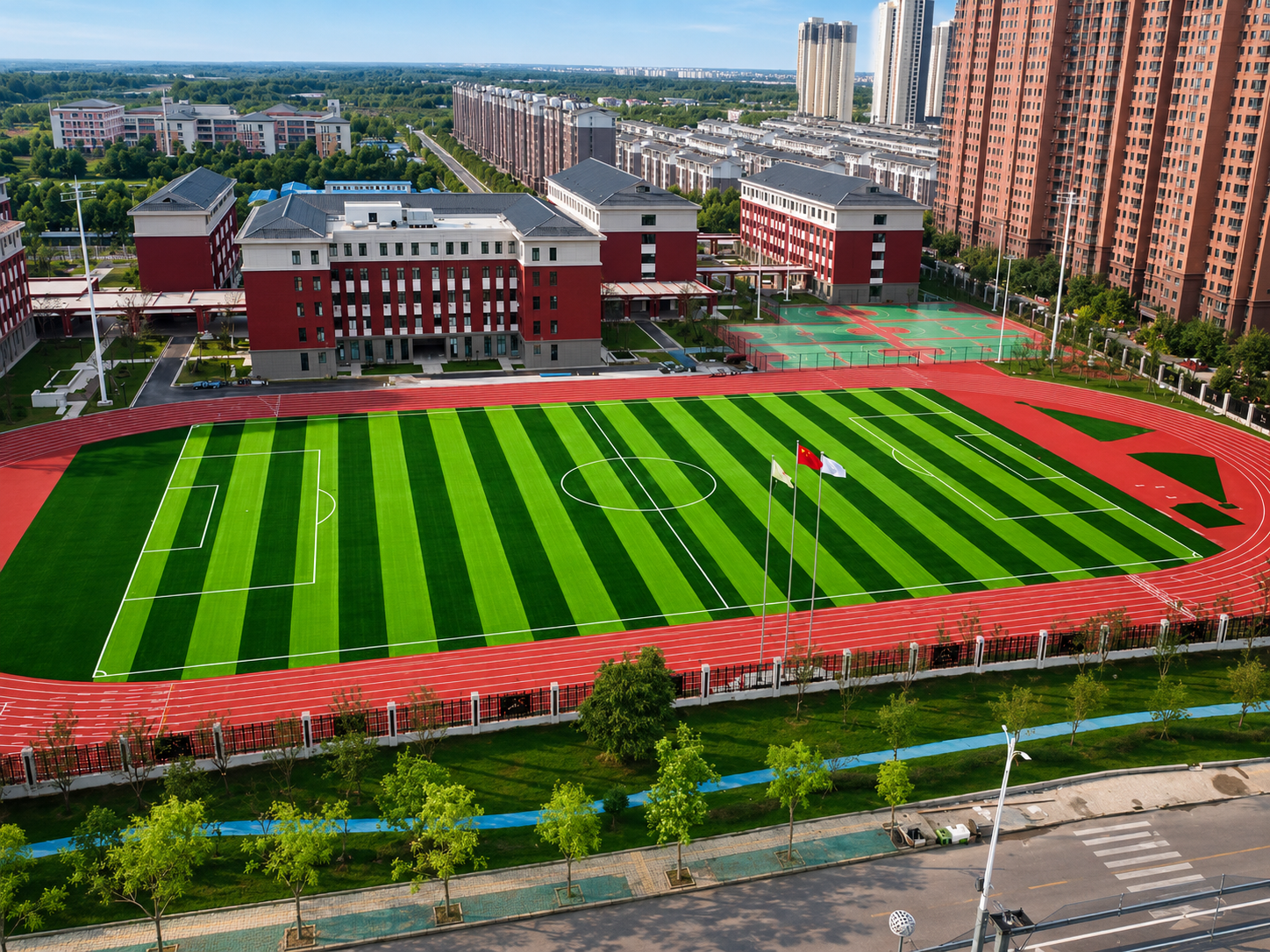 Aerial view of a school football field project supplied by JZS