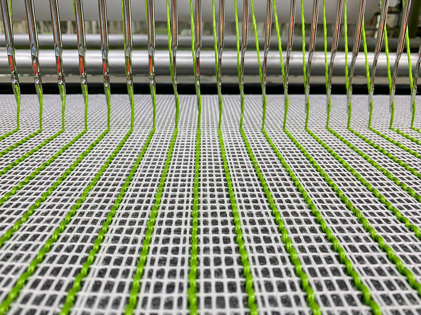 Artificial grass tufting process during JZS in-house production