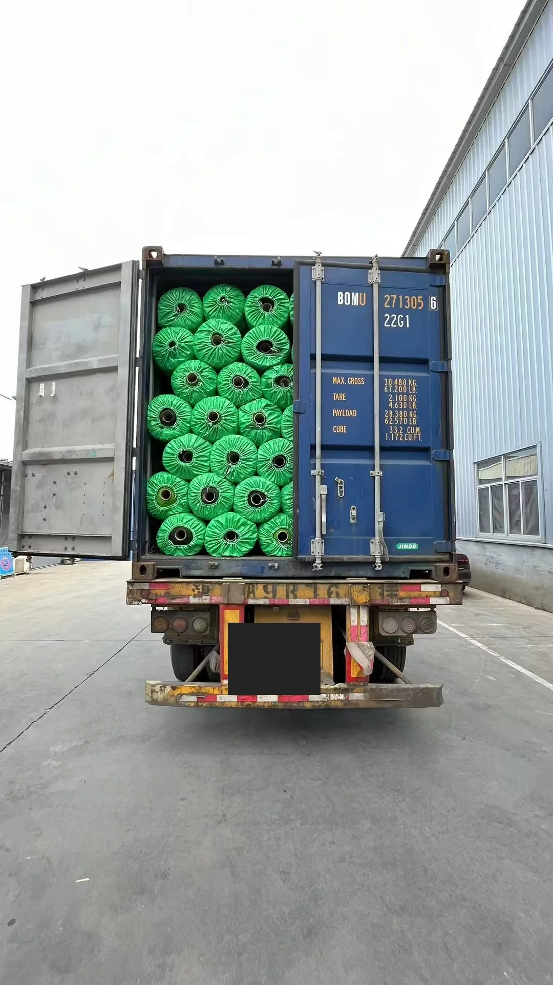Artificial grass rolls loaded into export container for B2B shipment