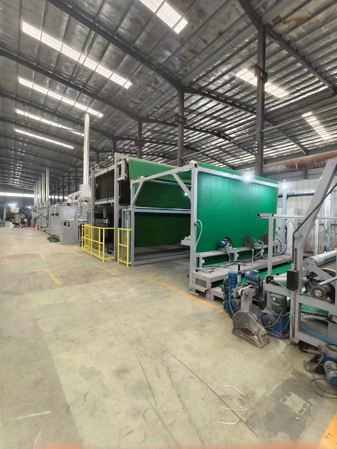Artificial grass production line inside JZS Turf factory