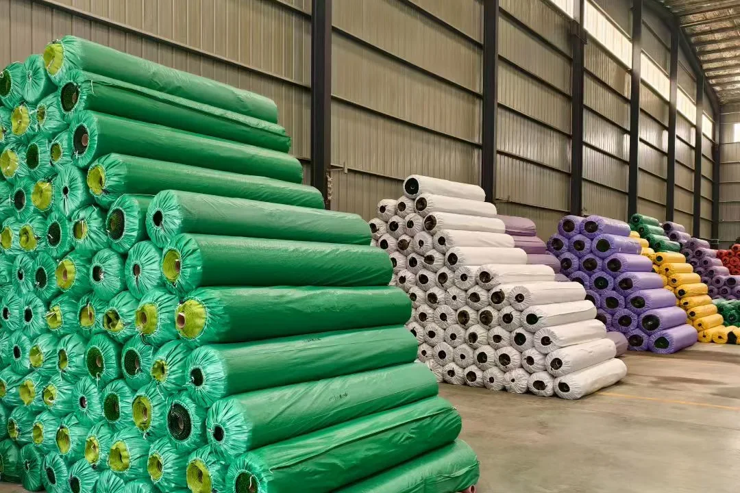 Artificial grass rolls stored in warehouse stock