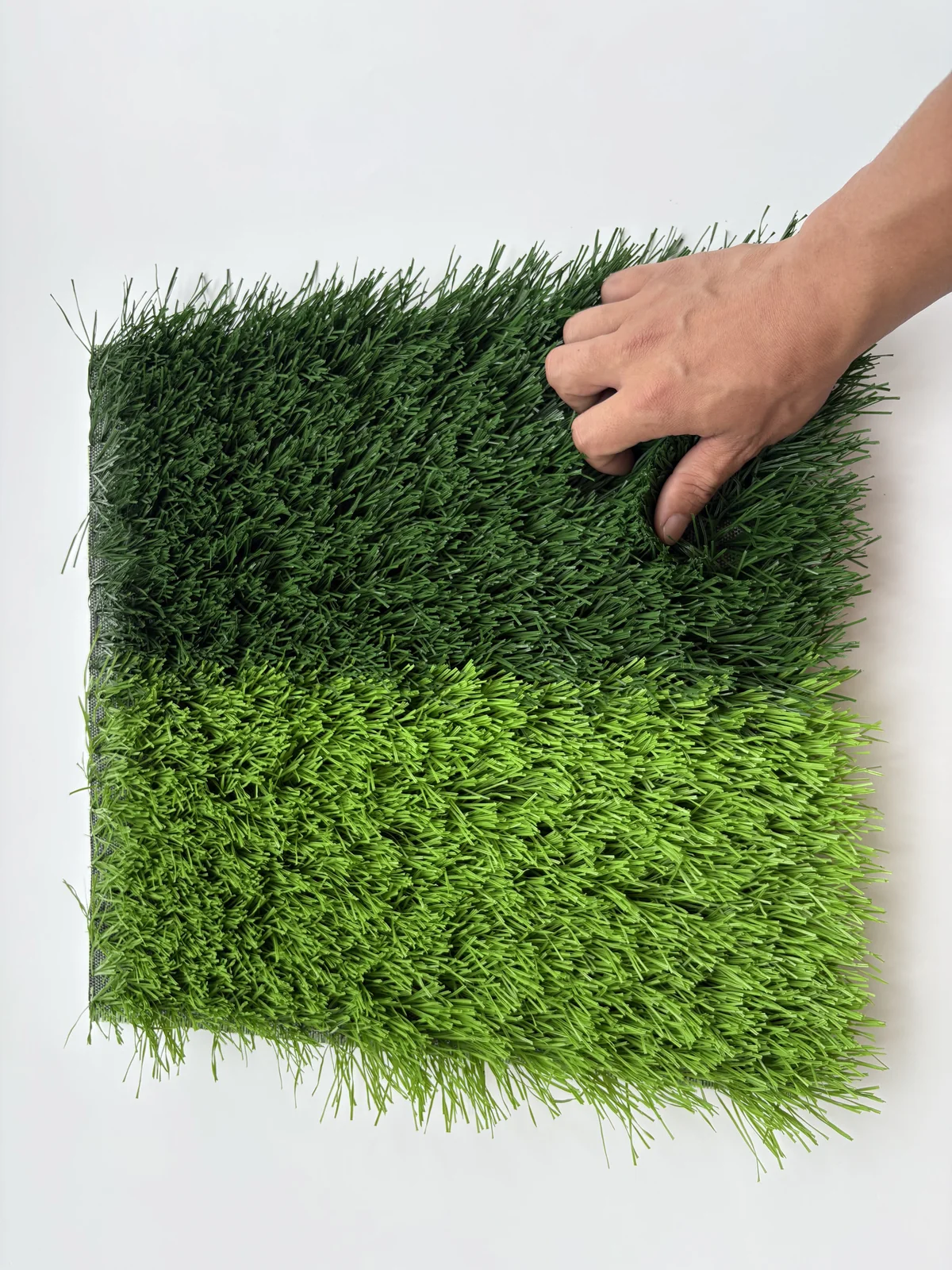 Football artificial turf hand scale and texture view
