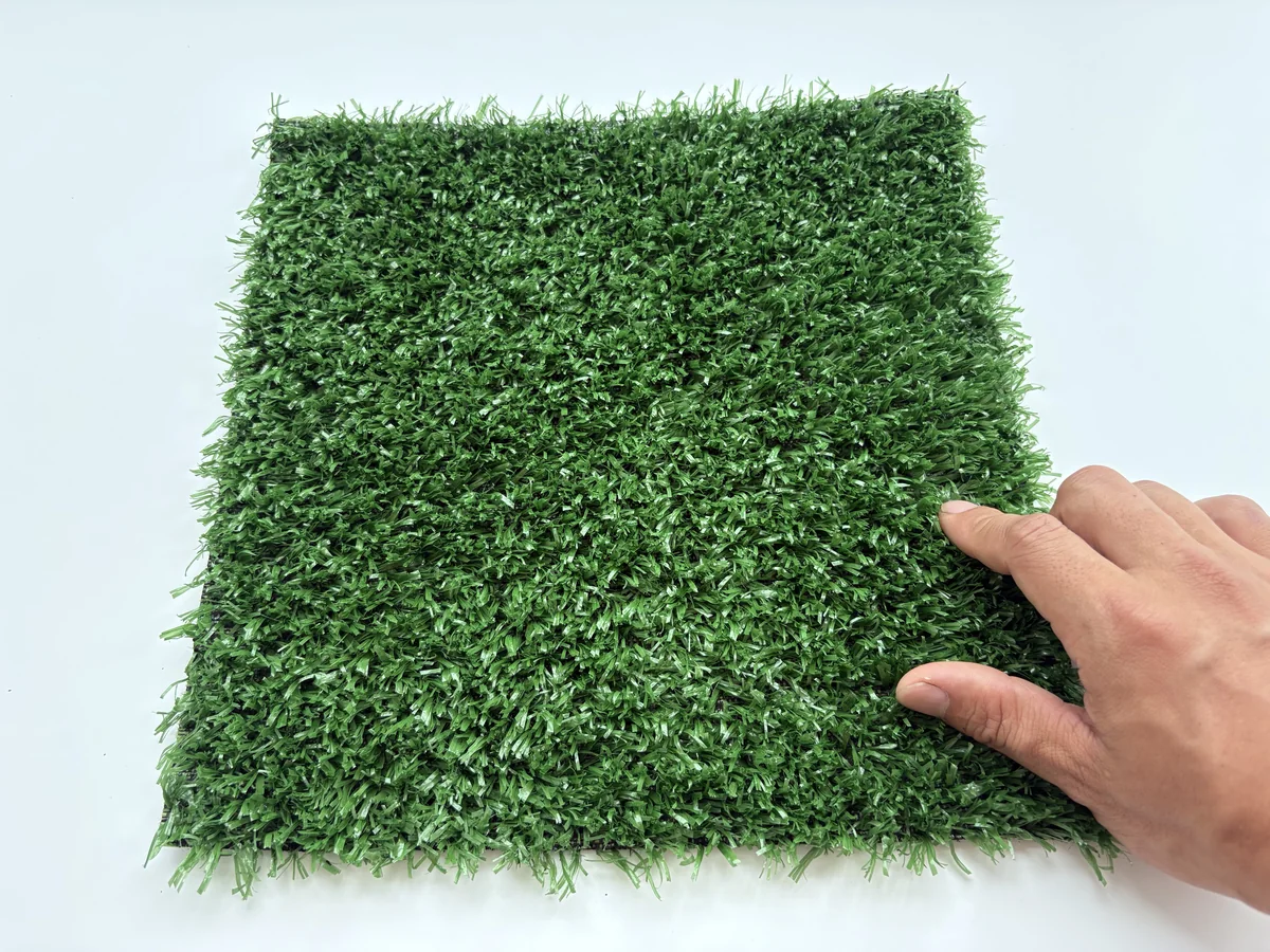 Fence and wall artificial grass hand scale and texture view