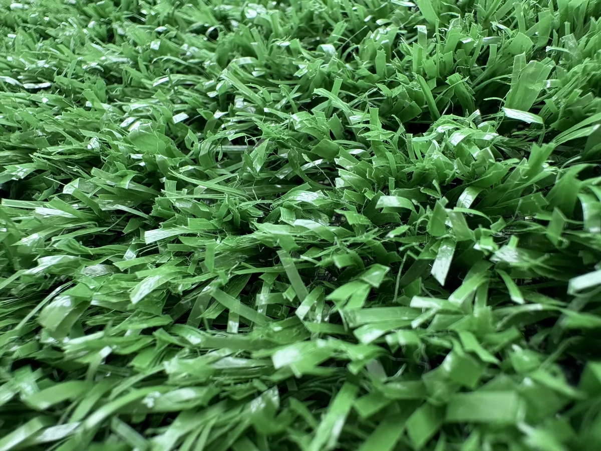 Fence and wall artificial grass yarn close-up for product review